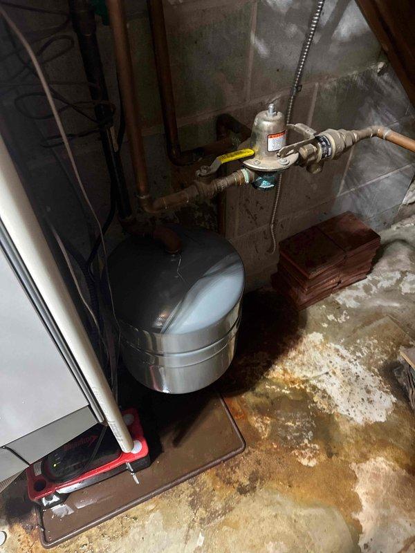 Responded to service call for Ariston Prestige boiler unexpectedly filling and leaking. Diagnostic inspection revealed waterlogged expansion tank causing system pressure issues and leakage. Successfully replaced expansion tank to restore proper system operation and prevent further water damage.