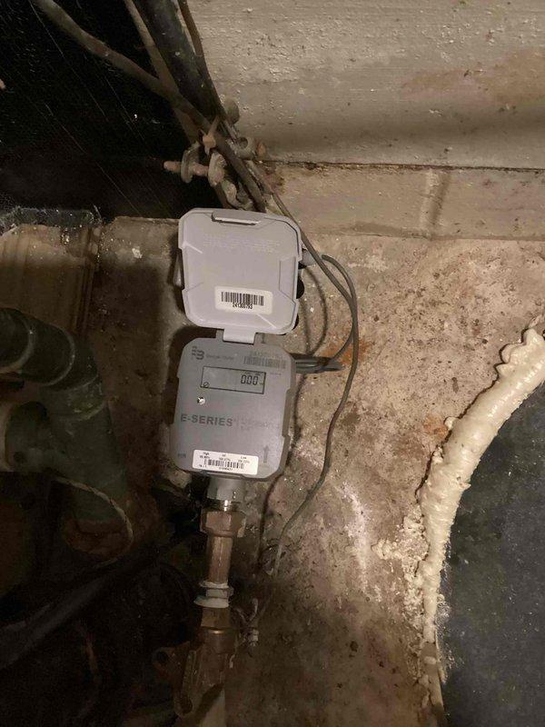 Responded to service call for suspected water leak causing floor damage in kitchen and dining room. Performed comprehensive inspection of water supply lines, drain systems, and ceiling in basement with no active leaks detected. Inspected water meter and documented readings with E-Series meter showing normal operation.
