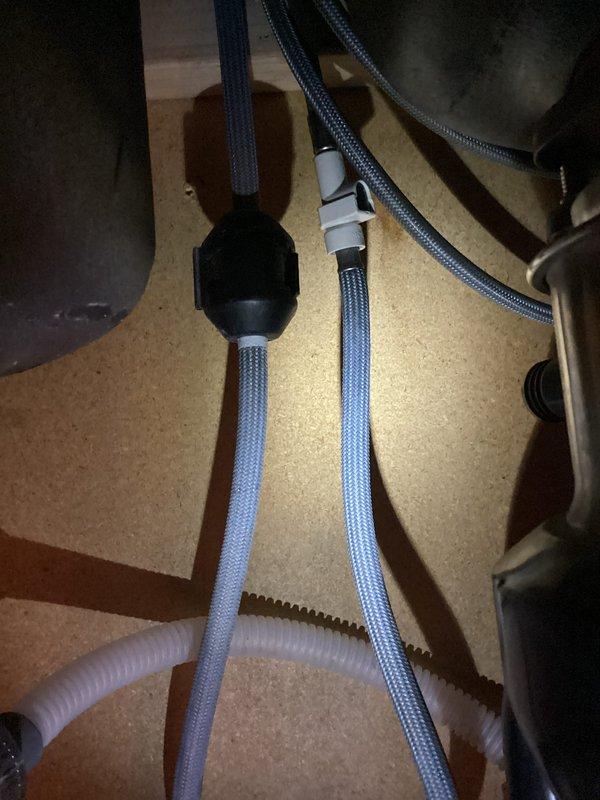 Responded to service call for kitchen sink leak. Inspected and identified Moen pull-down hose as source of leakage. Ordered replacement hose and provided customer with estimate for optional in-line water filtration system installation.