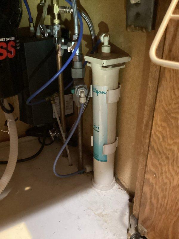 Responded to service call for kitchen sink leak. Inspected and identified Moen pull-down hose as source of leakage. Ordered replacement hose and provided customer with estimate for optional in-line water filtration system installation.