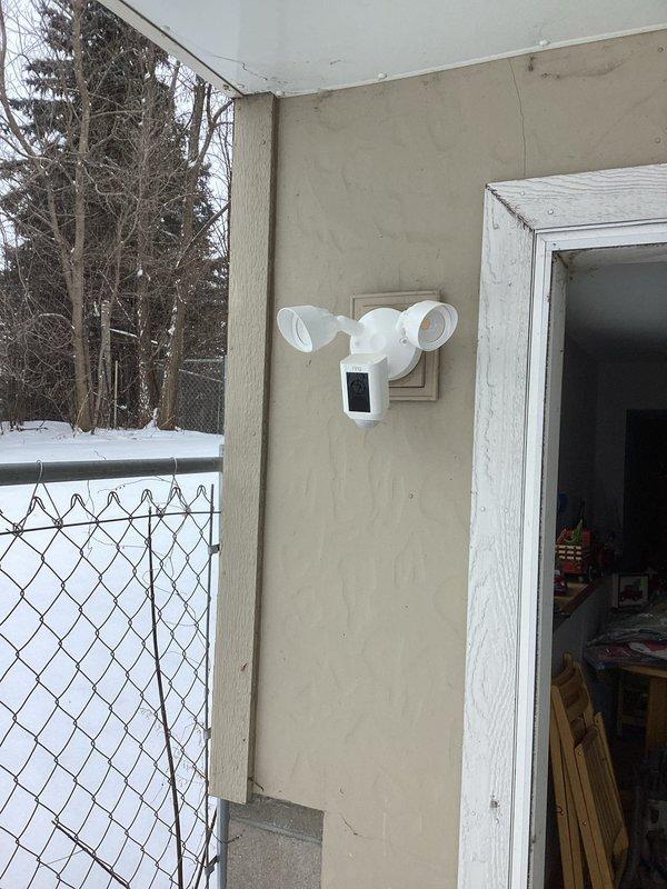 Completed installation of two Ring camera floodlights on the exterior stucco walls of the residence. Properly mounted and secured the smart security fixtures near doorways, ensuring proper functionality of both the motion-activated floodlights and integrated cameras as part of the customer's smart home technology upgrade.