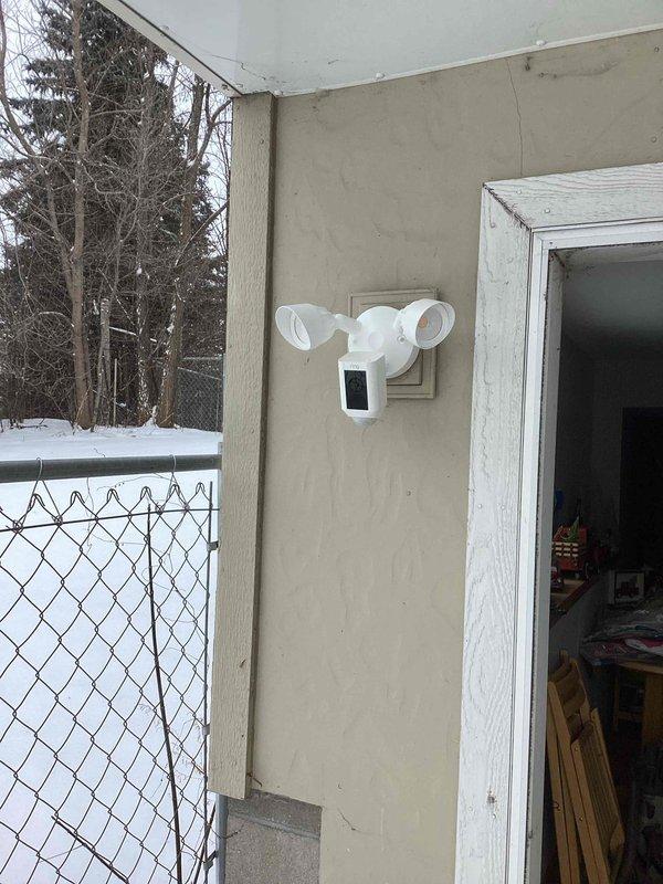 Completed installation of two Ring camera floodlights on the exterior stucco walls of the residence. Properly mounted and secured the smart security fixtures near doorways, ensuring proper functionality of both the motion-activated floodlights and integrated cameras as part of the customer's smart home technology upgrade.