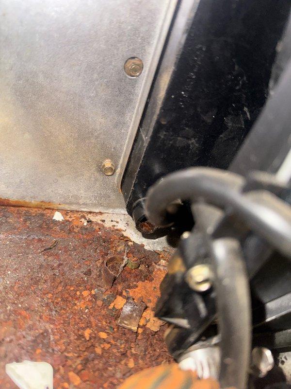 Responded to service call for furnace noise complaint. Diagnostic inspection revealed blower motor failure caused by filter being pulled into blower motor assembly, resulting in bent motor shaft. Observed extensive rust development on secondary heat exchanger. Documented electrical connection integrity and corrosion issues with photos. Recommended complete system evaluation for repair options or potential replacement.