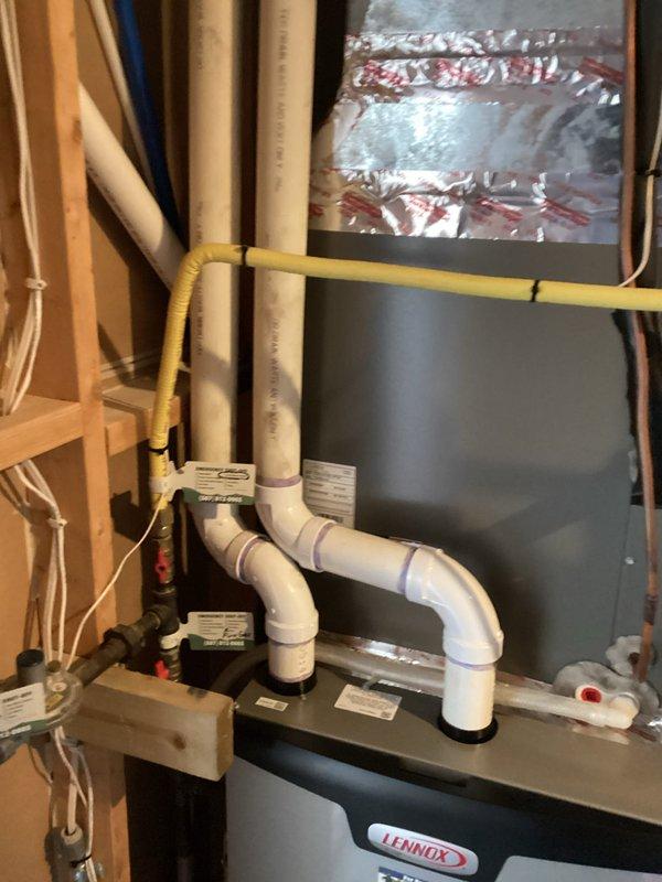 Performed scheduled preventative maintenance agreement service on Lennox heating system. Conducted comprehensive tune-up of furnace components and verified proper operation of all systems. Documented installation with photos showing appropriate PVC venting configuration and proper installation of unit in utility area.