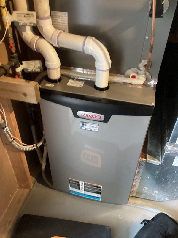 Performed scheduled preventative maintenance agreement service on Lennox heating system. Conducted comprehensive tune-up of furnace components and verified proper operation of all systems. Documented installation with photos showing appropriate PVC venting configuration and proper installation of unit in utility area.