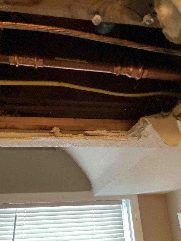 Located and repaired a pinhole leak in copper water line. Accessed the affected pipe through existing structural openings, cut out the damaged section, and installed new copper pipe. Restored water service and verified complete resolution with no further leakage.