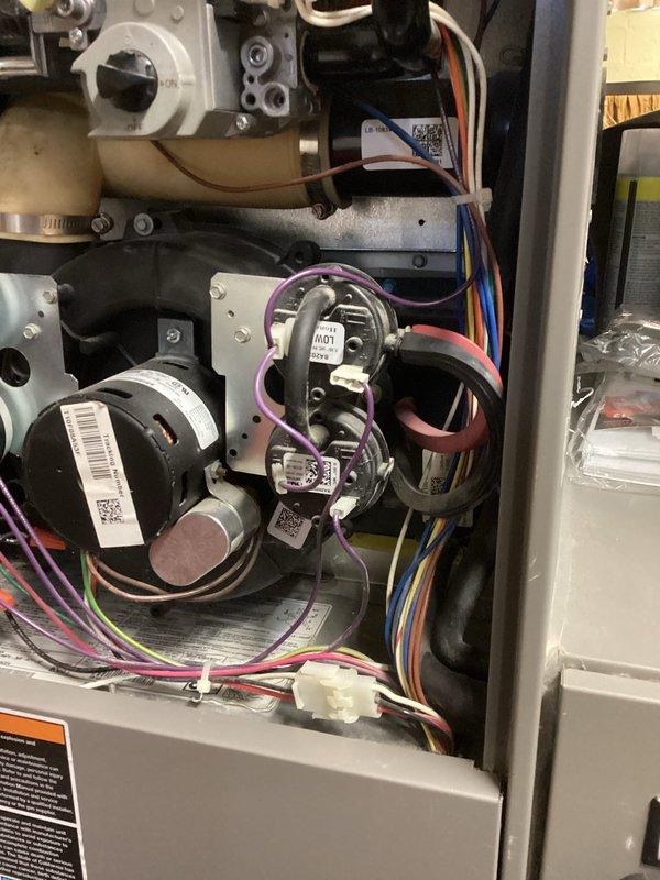 Diagnosed no heat issue on older Lennox furnace system. Found water accumulation in pressure switch tubing causing furnace failure. Cleared blocked pressure switch lines which restored proper operation of heating cycle while maintaining fan functionality.