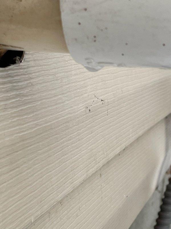 Responded to customer concern regarding ice formation on exterior exhaust pipe. Diagnosed condensation issue at termination point. Discovered and repaired unglued PVC fitting that was causing the problem, ensuring proper sealing to prevent potential exhaust gas intrusion into the residence.