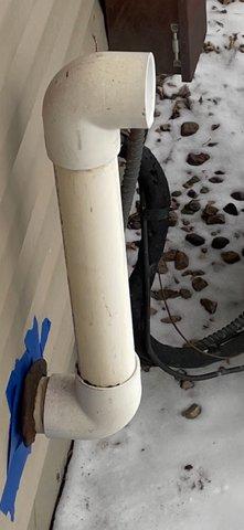 Responded to customer concern regarding ice formation on exterior exhaust pipe. Diagnosed condensation issue at termination point. Discovered and repaired unglued PVC fitting that was causing the problem, ensuring proper sealing to prevent potential exhaust gas intrusion into the residence.