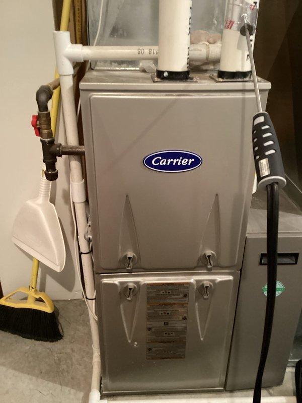 Conducted annual tune-up service on Carrier furnace system. Performed combustion analysis with readings showing normal CO levels (23F), CO₂ at 39P, 7.0% CO2, and 4.6% excess air. All components inspected and functioning properly with no issues identified.