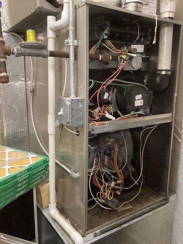 Responded to commercial building with residential HVAC unit not producing heat. Diagnosed failed pilot light and error code on one of eight furnaces. Upon inspection of internal components and heat exchanger, determined fault in control board and gas valve. Replaced defective components to restore proper heating function.