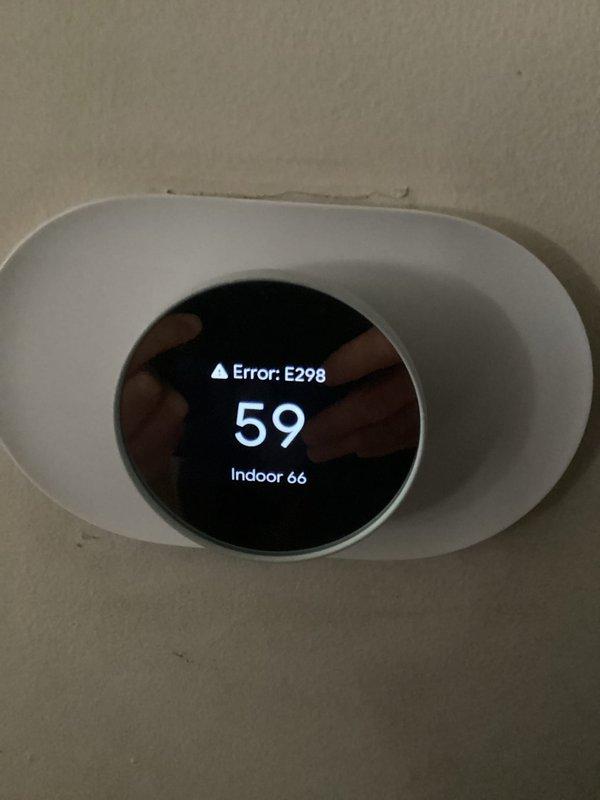 Responded to emergency no-heat call for 10+ year old furnace. Diagnosed failed blower motor or ECM module, evidenced by abnormal sounds from fan over past week and complete heat loss. Thermostat displaying Error E298 with temperature discrepancy between setpoint and actual indoor reading. Due to age and condition of unit, recommended full furnace replacement.