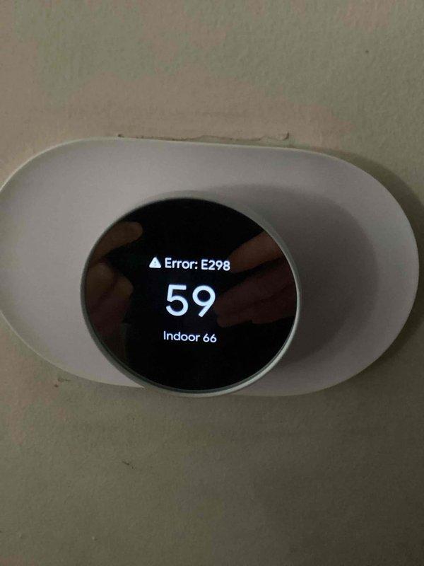 Responded to emergency no-heat call for 10+ year old furnace. Diagnosed failed blower motor or ECM module, evidenced by abnormal sounds from fan over past week and complete heat loss. Thermostat displaying Error E298 with temperature discrepancy between setpoint and actual indoor reading. Due to age and condition of unit, recommended full furnace replacement.