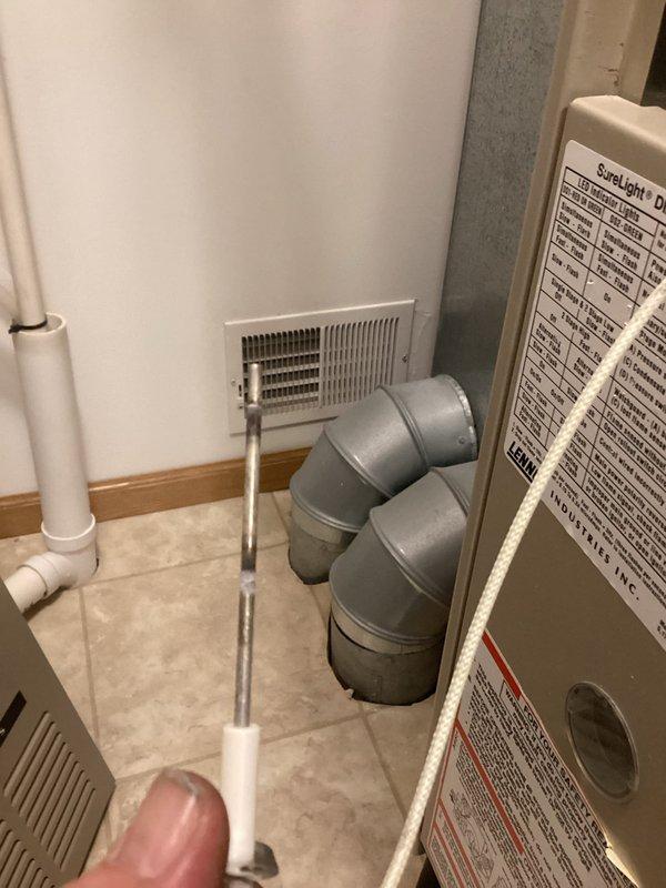 Diagnosed no heat issue in Lennox furnace located in utility room. Visual inspection revealed dirty flame sensor causing heating failure. Service performed: cleaned flame sensor to restore proper flame detection. System now operating normally with proper heat output.