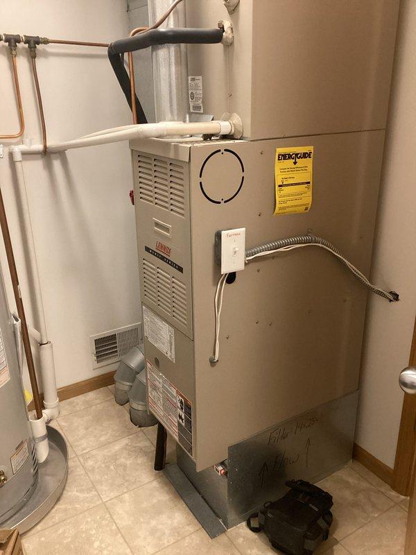 Diagnosed no heat issue in Lennox furnace located in utility room. Visual inspection revealed dirty flame sensor causing heating failure. Service performed: cleaned flame sensor to restore proper flame detection. System now operating normally with proper heat output.