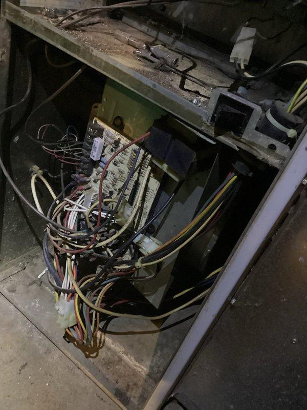 Responded to no-heat emergency call and diagnosed failed blower motor in aging furnace. Inspected control board and wiring connections, noting significant dust accumulation and wear. Recommended complete unit replacement due to furnace's overall condition and age.