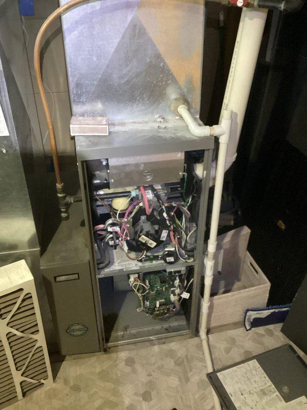 Responded to emergency no-heat call for aging furnace system. Diagnosed multiple issues including clogged components causing backup into inducer motor, slow leak in inducer motor, and dirty filter. Determined unit's age and condition make replacement more advisable than repair; recommended complete furnace replacement and duct cleaning rather than isolated inducer motor repair.