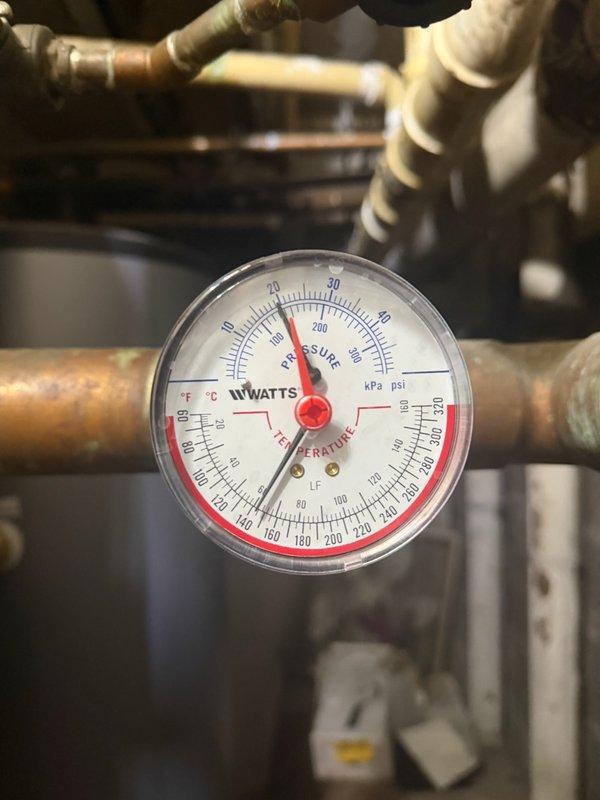 Responded to emergency no-heat call for rental property. Diagnosed failed main loop circulation pump as the cause of insufficient heat delivery. Replaced defective pump with new ECM model. Verified system operation with supply temperature reaching 180°F and return at 164°F at 17.0 psi, confirming proper heat distribution has been restored.