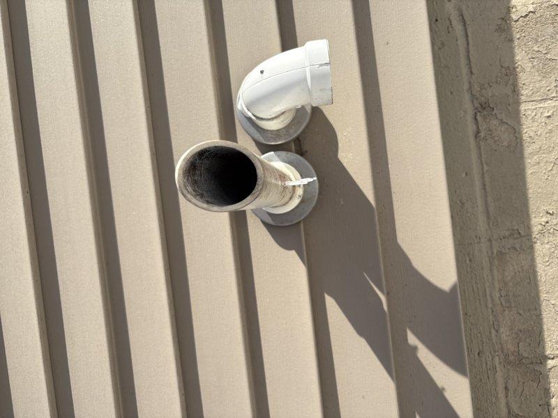 Responded to a no-heat call for a system over 10 years old. Diagnostic inspection revealed a failed high limit switch and compromised heat exchanger. Observed significant sooting around the exhaust vent pipe, confirming combustion issues. Presented customer with options to either repair or replace the aging system due to safety concerns.