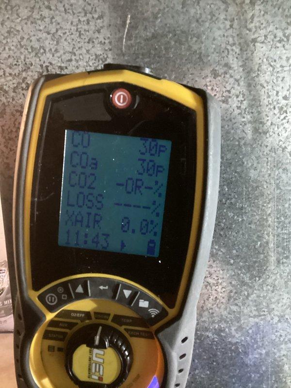 Responded to emergency no-heat call for furnace not producing warm air. Diagnosed two issues: excessive gas pressure and improperly installed concentric vent diverter plate. Corrected gas pressure to manufacturer specifications and properly repositioned combustion chamber door, restoring proper operation. Verified proper operation using multimeter and combustion analyzer testing.