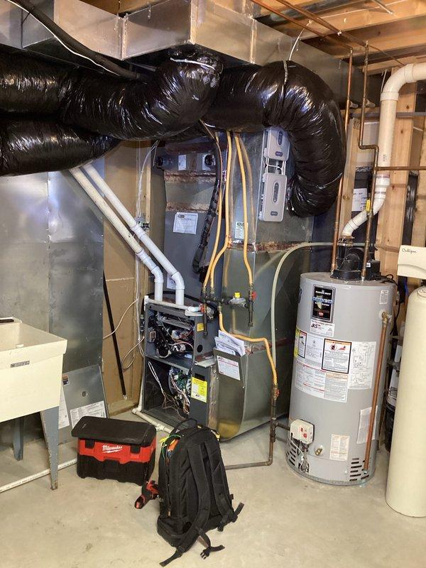 Responded to emergency no-heat call for furnace displaying E228 error code. Diagnosed improper installation with intake and exhaust pipes swapped, positioned hazardously above a doorway. Documented issue with photos and noted requirement for follow-up service to correctly reposition ventilation components to eliminate safety hazard.