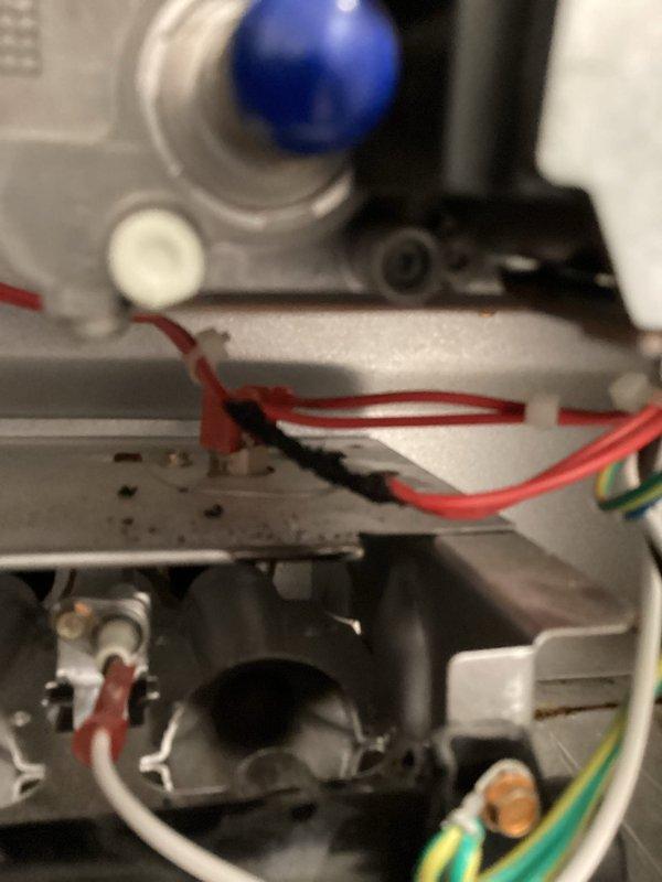 Responded to emergency no-heat call at mobile home where thermostat was inoperative. Upon inspection, discovered melted wires within the heating system's control assembly. Repaired the damaged connections by reconnecting wires and repositioning components to prevent future thermal damage, restoring heating functionality.