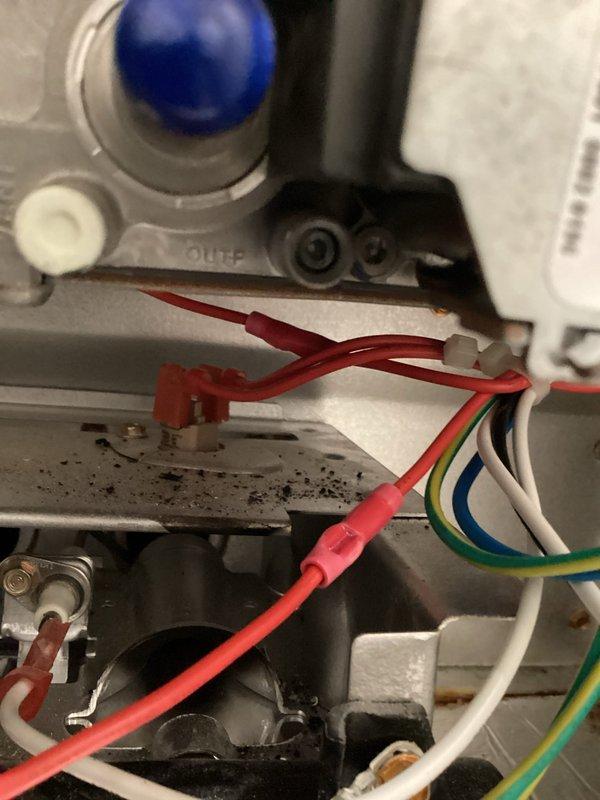 Responded to emergency no-heat call at mobile home where thermostat was inoperative. Upon inspection, discovered melted wires within the heating system's control assembly. Repaired the damaged connections by reconnecting wires and repositioning components to prevent future thermal damage, restoring heating functionality.