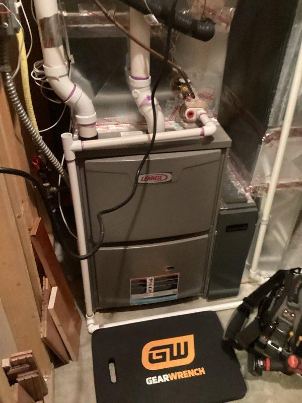 Performed scheduled tune-up service on Lennox furnace system with arrival between 8-12 as arranged. Conducted comprehensive inspection and maintenance of air handler unit, including examination of PVC ventilation pipes, electrical connections, and refrigerant lines. System was found to be in proper working condition with no issues identified.