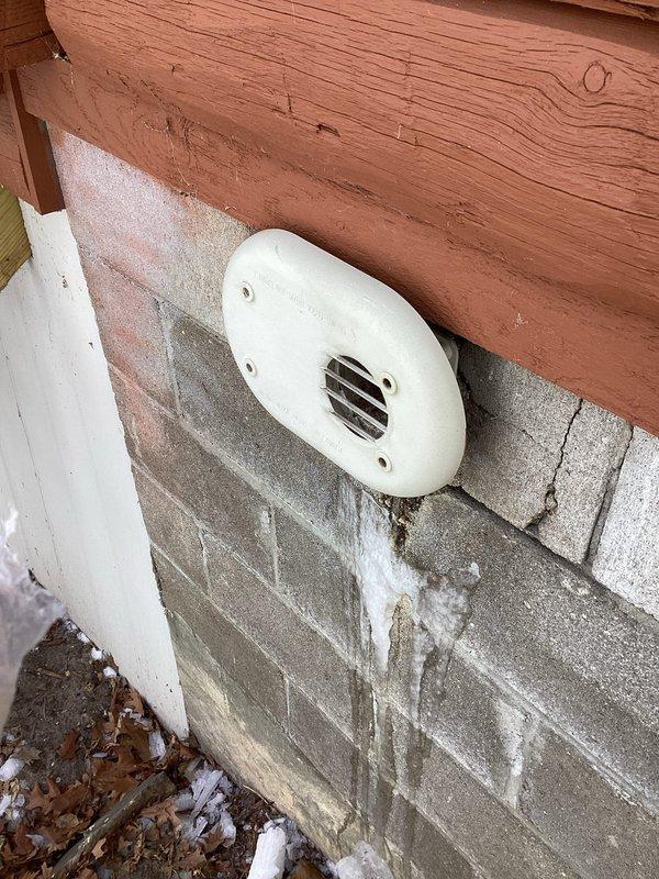 Responded to no-heat complaint and discovered debris accumulation in condensate trap, exhaust, and intake components. Thoroughly cleaned exhaust and intake passages using vacuum equipment, thawed frozen components, and successfully installed concentric kit to restore proper system operation.