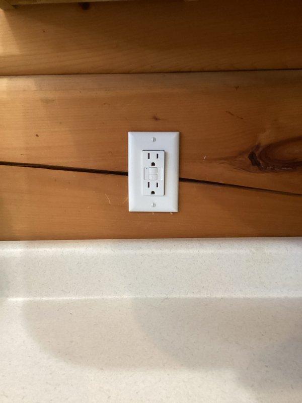 Responded to service call for non-functional outlet used during duct cleaning. Diagnosed faulty GFCI outlet. Removed defective unit and installed new GFCI outlet on wooden wall, verifying proper operation after installation.