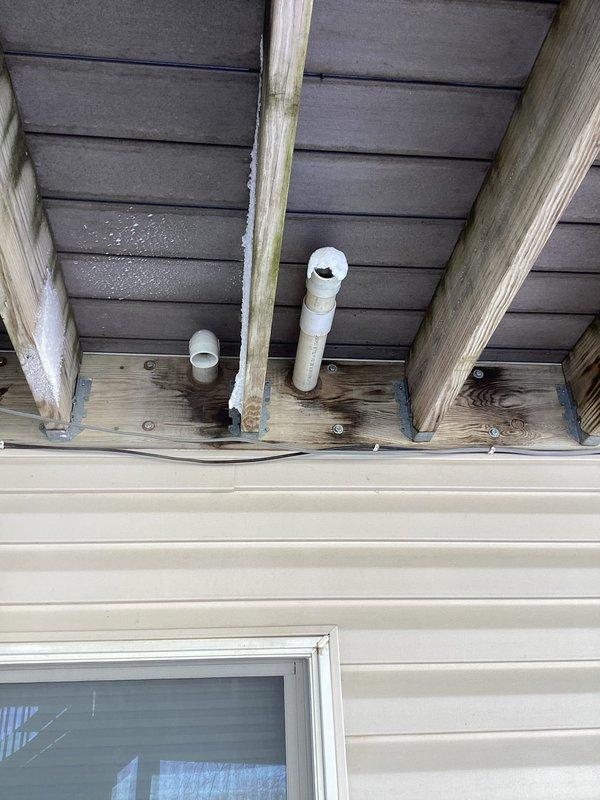 Responded to no-heat service call and diagnosed two critical issues: improper drain line installation without proper trap between collector box and humidifier causing flue gas to enter home, and inadequate exhaust venting resulting in flue gas recirculation. Corrected by installing separate drain lines with proper trapping for both collector box and humidifier, and extended/supported exhaust piping to prevent dangerous combustion gas recirculation.