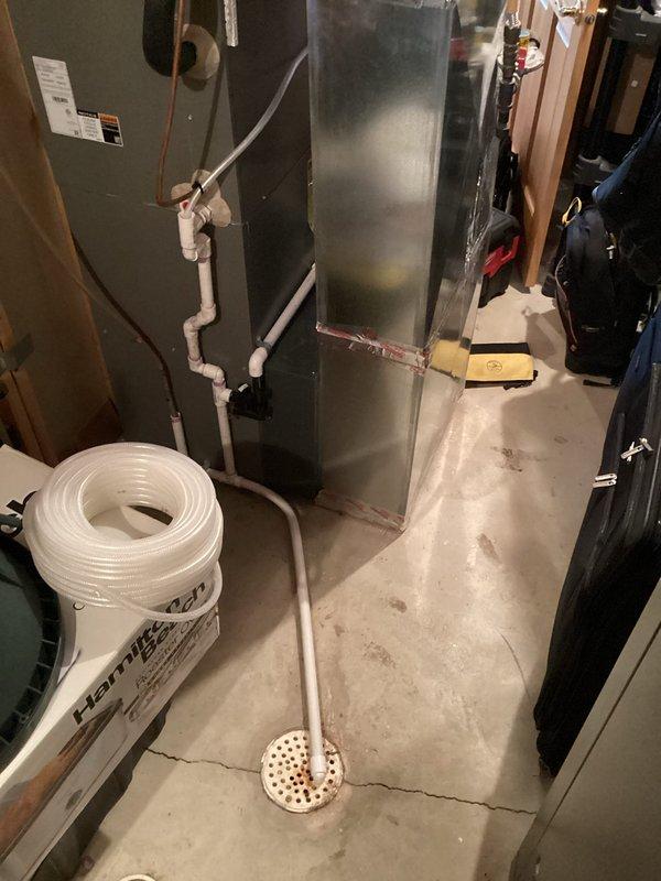 Responded to no-heat service call and diagnosed two critical issues: improper drain line installation without proper trap between collector box and humidifier causing flue gas to enter home, and inadequate exhaust venting resulting in flue gas recirculation. Corrected by installing separate drain lines with proper trapping for both collector box and humidifier, and extended/supported exhaust piping to prevent dangerous combustion gas recirculation.