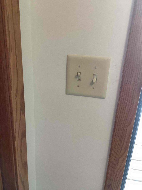 Responded to service call for non-functioning outdoor light and three outlets. Diagnosed issue as a loose connection at the wall switch that was previously serviced. Tightened connection and verified proper operation of all affected fixtures.