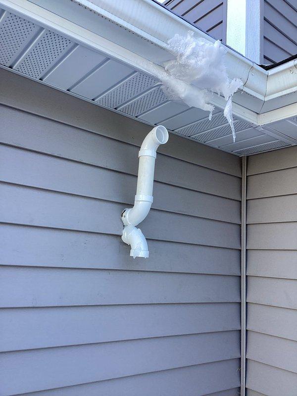 Responded to callback regarding excessive ice buildup on exhaust pipe. Identified insufficient separation between exhaust pipes as the root cause. Extended exhaust pipe past the structure to prevent freezing on the roof, ensuring proper venting and eliminating the ice accumulation issue.