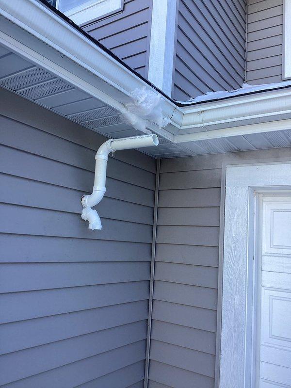 Responded to callback regarding excessive ice buildup on exhaust pipe. Identified insufficient separation between exhaust pipes as the root cause. Extended exhaust pipe past the structure to prevent freezing on the roof, ensuring proper venting and eliminating the ice accumulation issue.