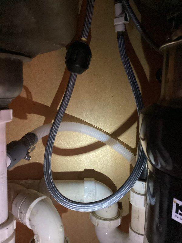 Completed return visit to install replacement pull-down hose for customer's faucet. Properly connected new hose to existing plumbing system, ensuring secure fit with drainage components and water filtration system. Tested operation to confirm proper function with no leaks.