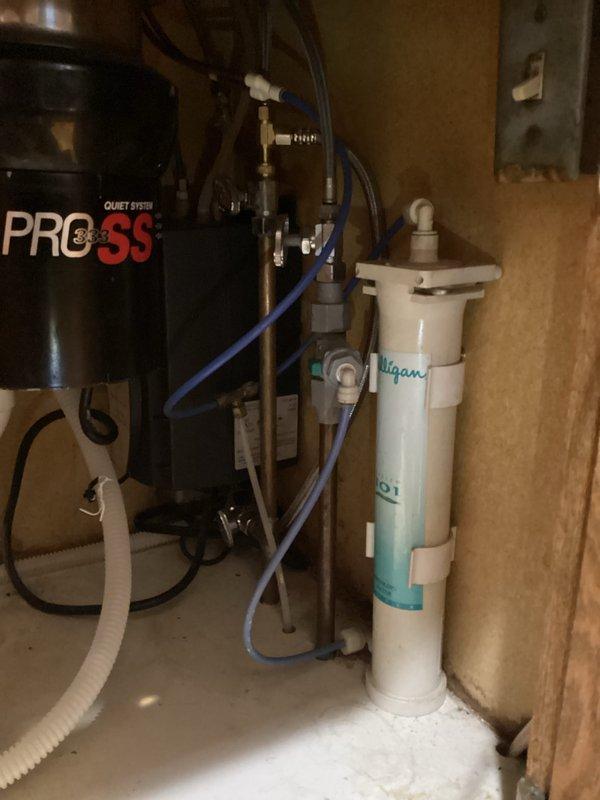 Completed return visit to install replacement pull-down hose for customer's faucet. Properly connected new hose to existing plumbing system, ensuring secure fit with drainage components and water filtration system. Tested operation to confirm proper function with no leaks.