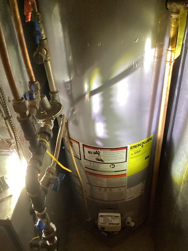 Responded to no hot water complaint and discovered gas valve to water heater had been turned off during previous day's furnace service by HVAC department. Restored gas supply to water heater, relit unit, and verified proper operation. Water heater now functioning normally with no additional issues observed.