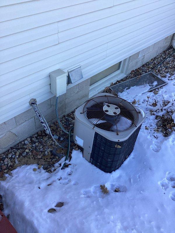 Responded to emergency no-heat call to find furnace blowing cold air with indoor temperature at 49°F. Upon inspection, determined heat exchanger had failed in aging system (10+ years old). Diagnosed issue, documented condition with photos of both outdoor unit and furnace with exposed components, and connected customer with project manager to discuss replacement options.