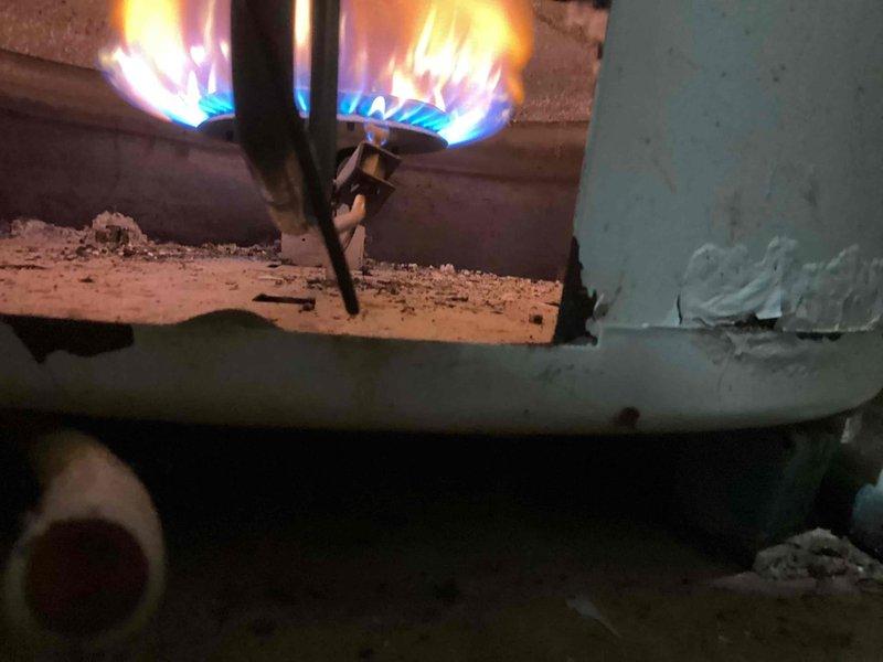 Responded to a call back for insufficient hot water after previous service. Diagnosed a faulty heat sensor on the 75-gallon atmospheric vent water heater. Installed new heat sensor which resolved the issue, allowing the unit to ignite properly and maintain temperature as set on the gas control valve. Verified proper burner operation and informed customer that due to the age of the unit, replacement may be necessary if further issues arise as AO Smith no longer manufactures replacement gas control valves for this model.