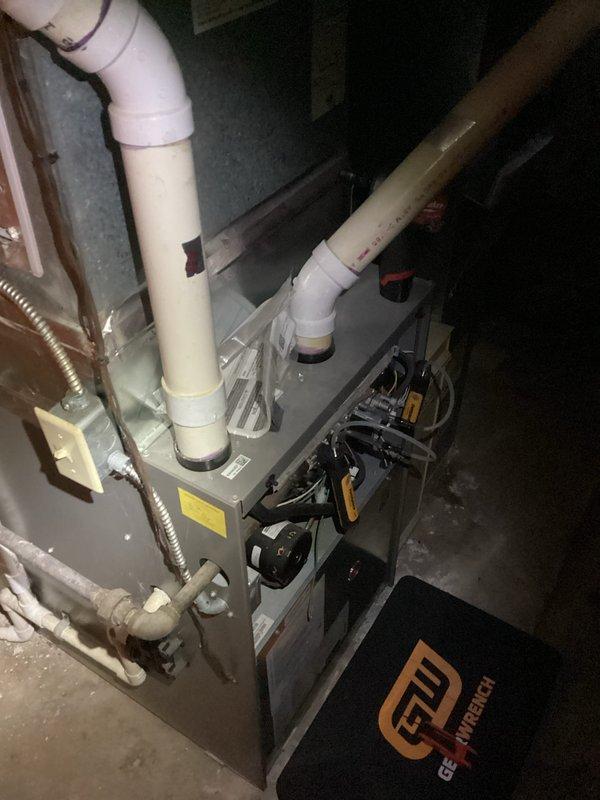 Performed scheduled maintenance tune-up on residential air handler furnace system. Inspected PVC vent pipes and connections for proper sealing. Unit was functioning normally with no issues identified. All maintenance procedures completed successfully.