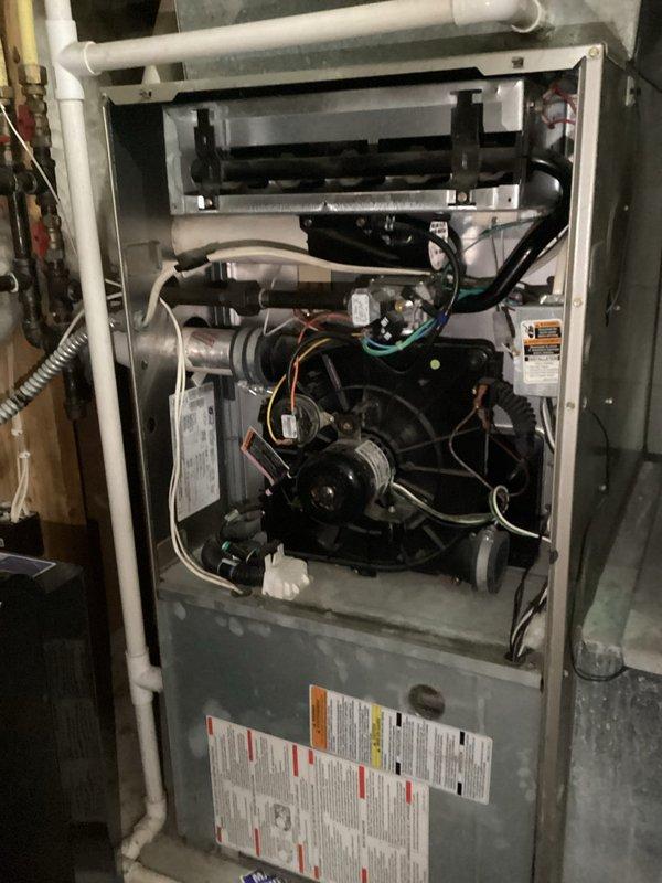 Responded to no heat call for aging furnace system. Diagnosed failed ignitor as root cause. Replaced faulty ignitor and performed standard maintenance service to restore proper heating function.