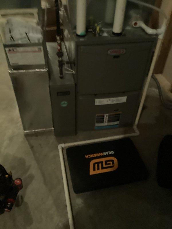 Performed scheduled tune-up service on Lennox furnace system located in utility room. Conducted comprehensive inspection of all components including air handler, ventilation, and drainage systems. All connections and PVC piping were verified to be properly installed and functioning correctly with no issues identified.