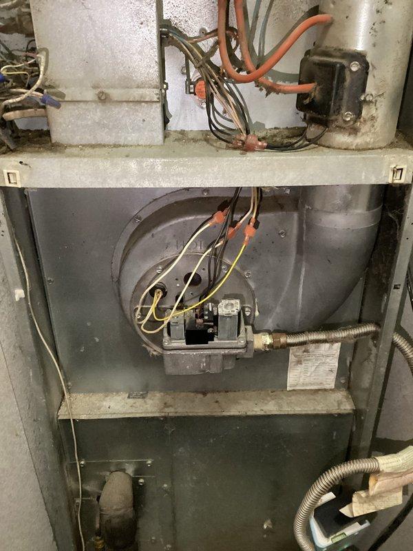 Responded to service call for 20+ year old furnace experiencing intermittent heating issues. Diagnostic inspection revealed aging gas valve opening slowly, causing inconsistent heating performance. Replaced gas valve and flame sensor to restore proper ignition sequence and reliable heating function. Customer advised that system replacement may be necessary in near future due to unit age.