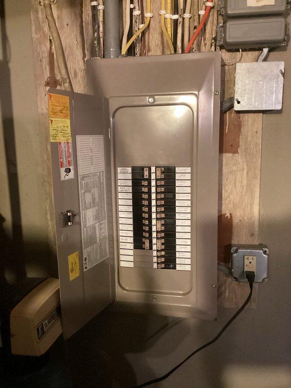 Conducted inspection of residential electrical panel to diagnose low voltage issues. Provided estimate for installation of recessed lighting in living room and disconnection of outdated selanoid wiring. Visual inspection of breaker panel revealed proper organization with labeled circuits and no visible damage.