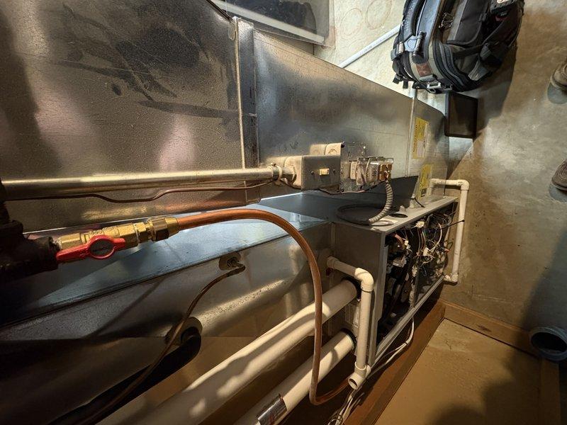 Diagnosed no heat condition in existing furnace system, confirming previous day's assessment. Upon customer approval, completed full system replacement with new furnace unit, including proper installation of all electrical connections, ductwork, and PVC venting. System now operational with all components properly secured and tested.