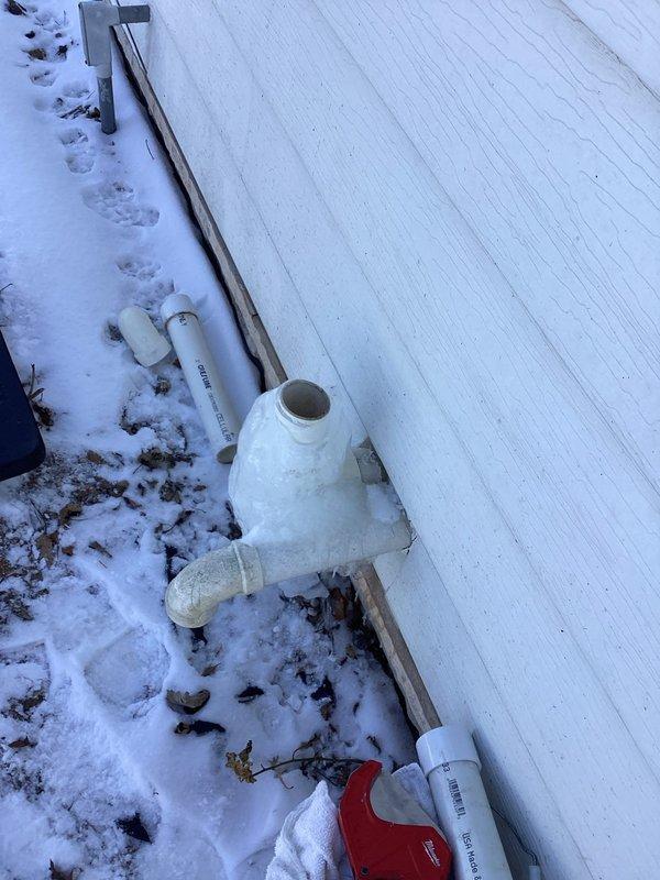 Responded to service call for detached exhaust pipe. Diagnosed broken PVC exhaust/vent piping at exterior wall. Successfully replaced damaged PVC components and restored proper venting system functionality.