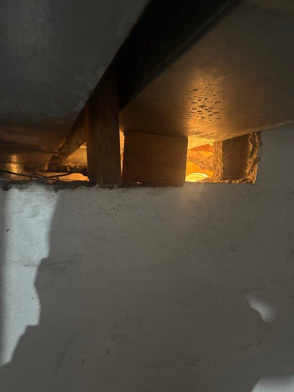 Responded to service call for frozen pipe issue affecting toilet. Pipe had thawed prior to arrival. Inspected crawl space but determined area with affected pipe was not accessible due to return duct placement. Installed heat tape around shutoff valve at the base of toilet fill valve to prevent future freezing incidents.