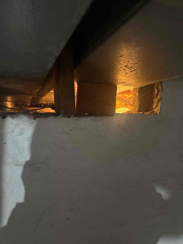 Responded to service call for frozen pipe issue affecting toilet. Pipe had thawed prior to arrival. Inspected crawl space but determined area with affected pipe was not accessible due to return duct placement. Installed heat tape around shutoff valve at the base of toilet fill valve to prevent future freezing incidents.