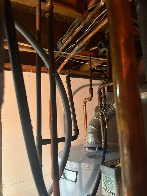 Responded to emergency no-heat call and discovered water leak from 1/2" copper line spraying directly onto boiler components. Patched damaged pipe section and thoroughly dried cabinet interior and flame sensor. System restored to normal operation after resolving both the water intrusion and heating failure.